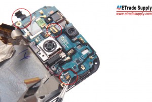 Pry up the Three Connectors that connect LCD Assembly and Motherboard Flex