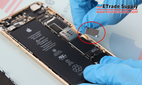 14. Undo the 2 screws that locking the metal cover above battery connector.