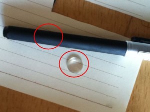 Select a pen that its diameter should be smaller than the magnifying glass.