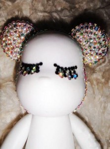 Paste the rhinestones on the whole head part of the teddy bear