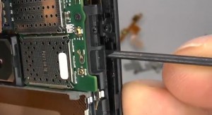 Use the thin bladed screwdriver to open the case gently