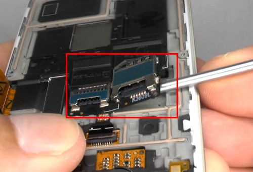 lift up the SIM card tray and SD card reader contact