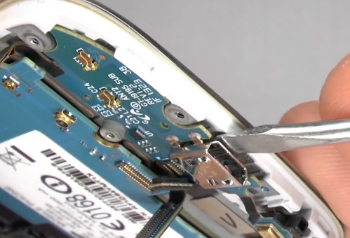 lift up the charging port flex cable and remove it