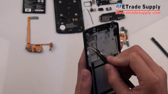 Peel off the Nexus 5 power button and volume button