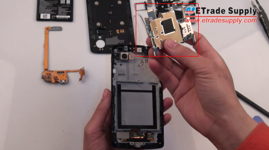 lift the metal shied underneath the Nexus 5