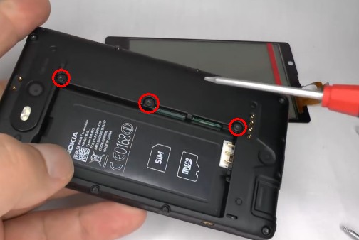 2undo the three center screws