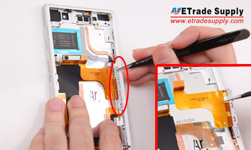 Loosen and take out the charging port flex cable ribbon