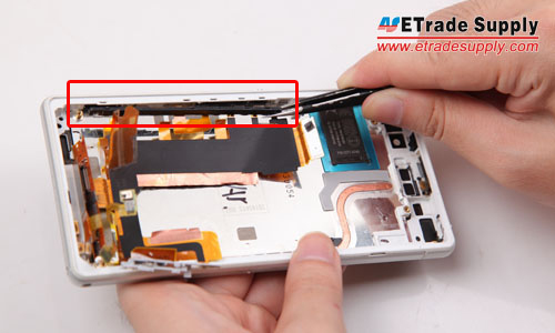 Take out the power button and camera button retaining bracket