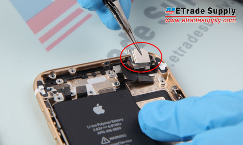22. Undo the 2 screws that locking the metal cover above the rear facing camera, then remove the camera.