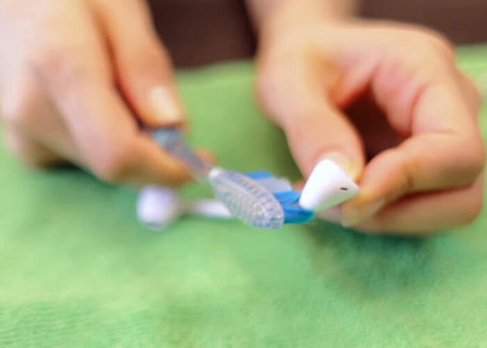 clean your earbuds with toothbrush