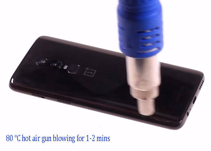 hot air gun blowing the battery back cover