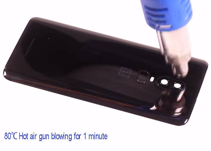 hot air gun blowing the battery cover
