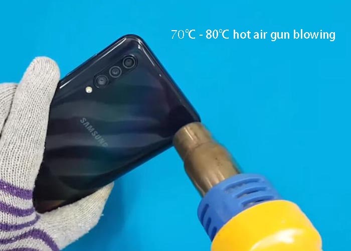 use hot air gun blowing the back panel