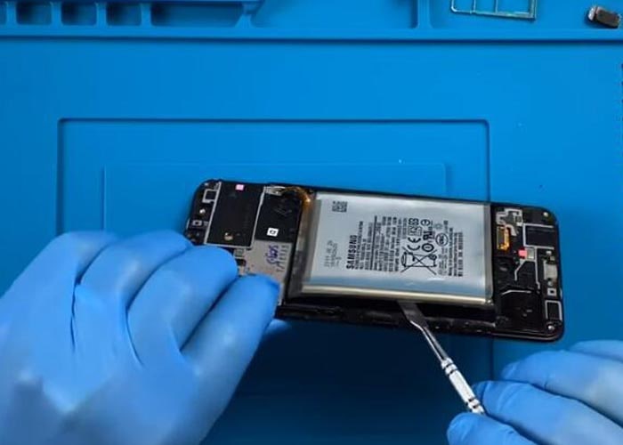 pry off the battery from the display frame