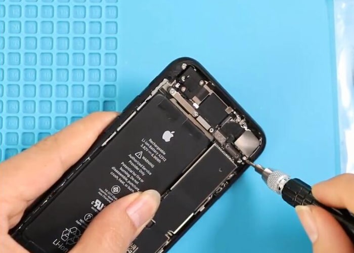 loosen the screws and remove the rear camera metal panel