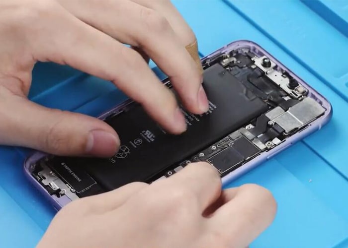 Install the battery into the iPhone