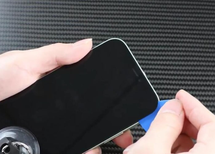 Slice around to separate the iPhone screen