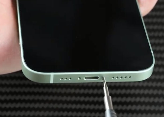 Assemble the iPhone 12 and tighten the two pentalobe screws